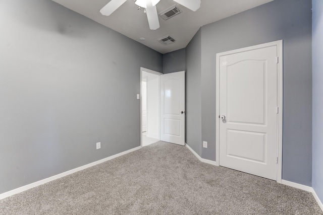 unfurnished bedroom with ceiling fan and light carpet