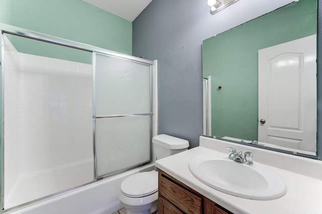 full bathroom with vanity, enclosed tub / shower combo, and toilet