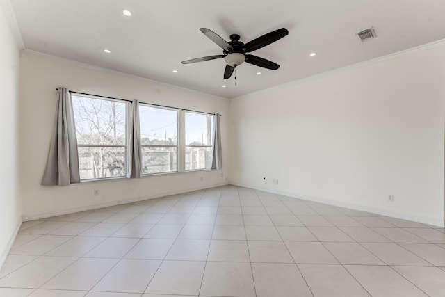 tiled empty room featuring crown molding and a healthy amount of sunlight