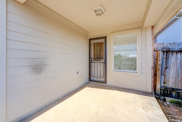 entrance to property featuring a patio