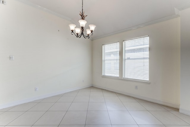 tiled empty room featuring a notable chandelier and ornamental molding