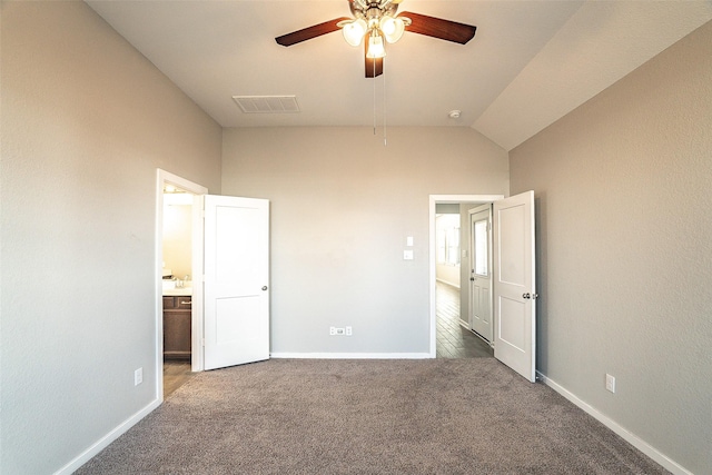 unfurnished bedroom featuring lofted ceiling, carpet floors, and ceiling fan