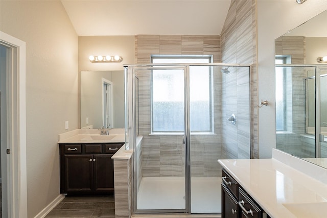 bathroom featuring vanity and an enclosed shower