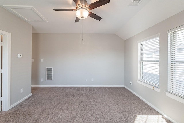 carpeted spare room with vaulted ceiling and ceiling fan