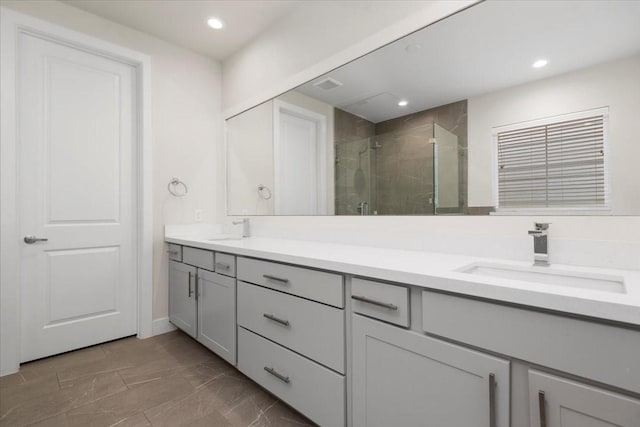 bathroom with vanity and an enclosed shower