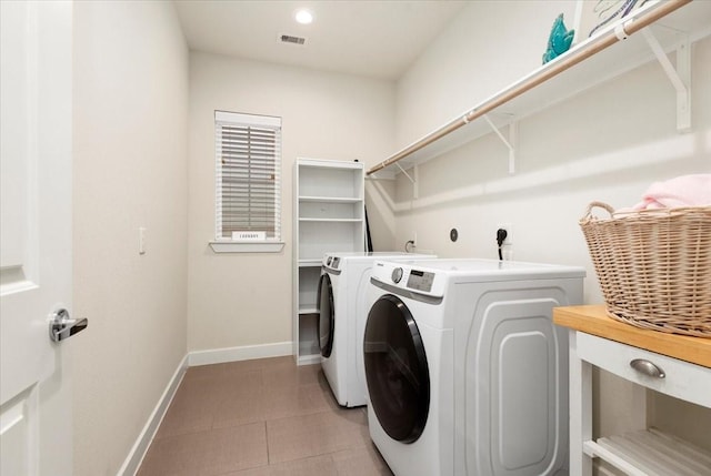 washroom featuring washer and dryer