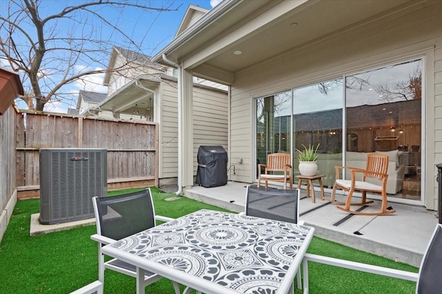 view of patio / terrace with area for grilling and central air condition unit