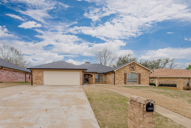 ranch-style home with a garage and a front yard