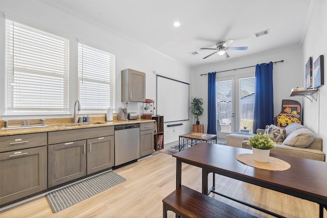 kitchen with sink, crown molding, dishwasher, ceiling fan, and light hardwood / wood-style floors