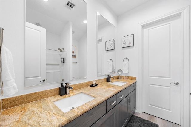 bathroom featuring hardwood / wood-style flooring and vanity