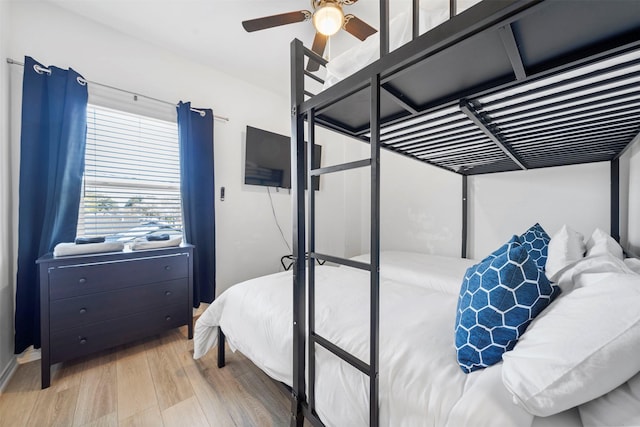 bedroom with wood-type flooring and ceiling fan