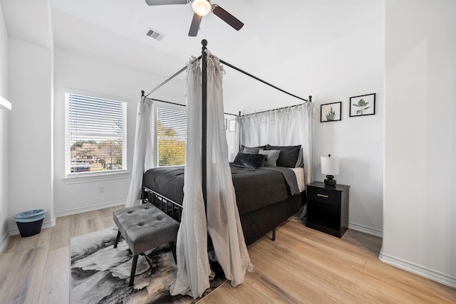 bedroom with ceiling fan and light hardwood / wood-style floors