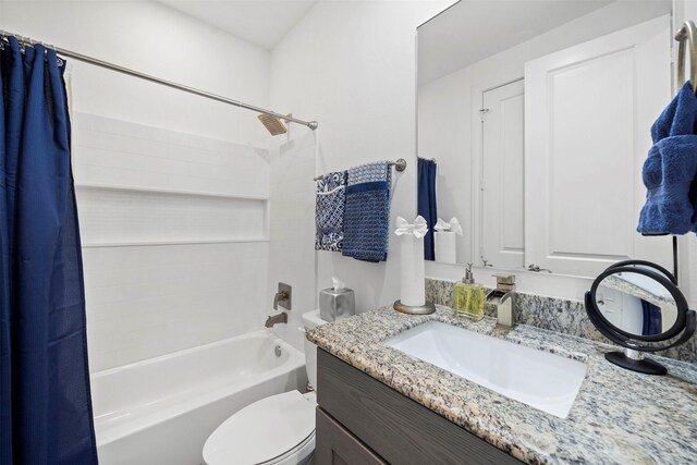 full bathroom featuring vanity, toilet, and shower / bath combo with shower curtain