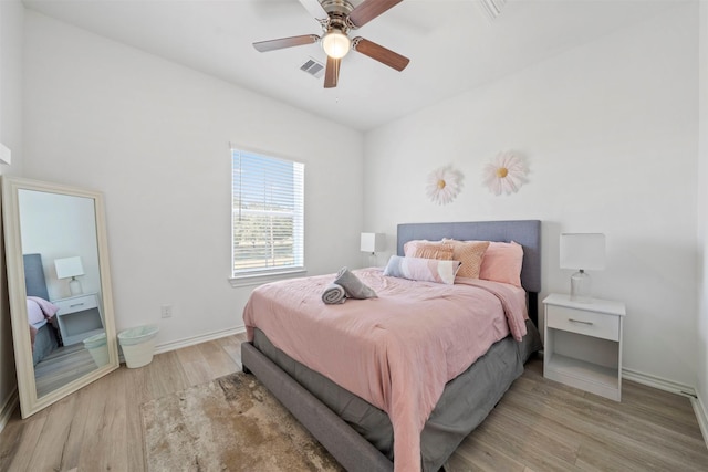 bedroom featuring light hardwood / wood-style flooring and ceiling fan