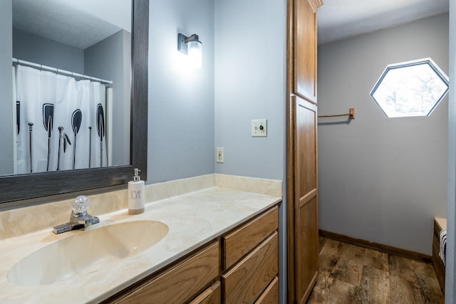 bathroom featuring vanity and hardwood / wood-style flooring