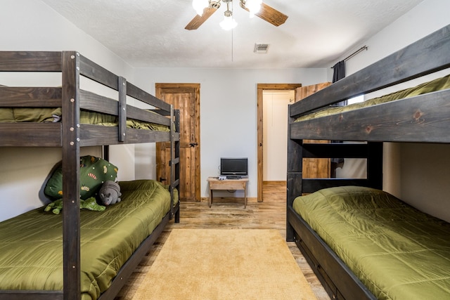 bedroom featuring ceiling fan and light wood-type flooring