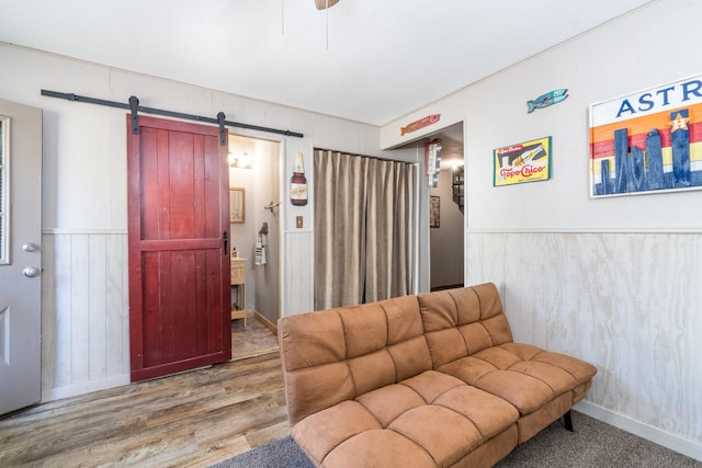 living room featuring hardwood / wood-style flooring and a barn door