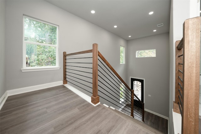 stairway with wood-type flooring