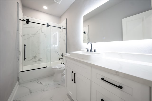 full bathroom featuring vanity, enclosed tub / shower combo, and toilet