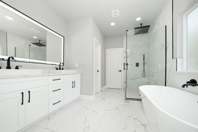 bathroom with vanity and an enclosed shower