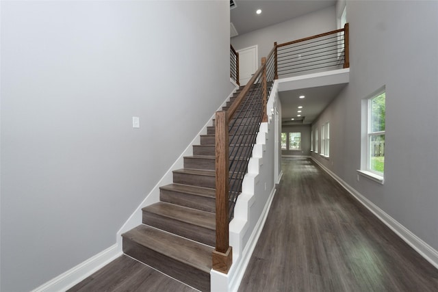 staircase featuring hardwood / wood-style flooring