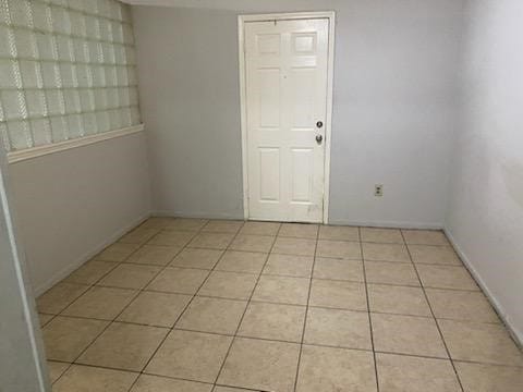 view of tiled spare room