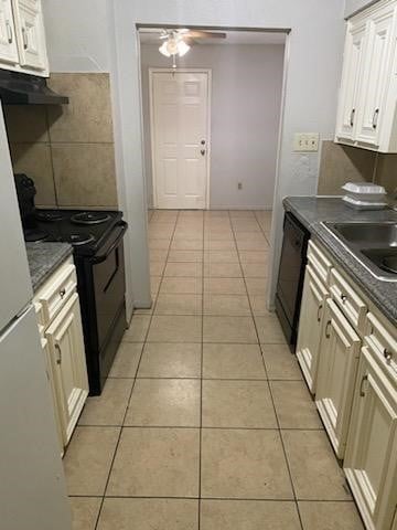 kitchen with light tile patterned floors, sink, ceiling fan, white cabinetry, and black appliances