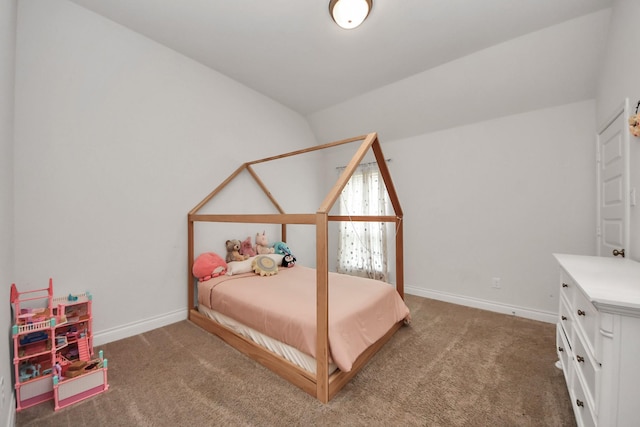 carpeted bedroom with lofted ceiling