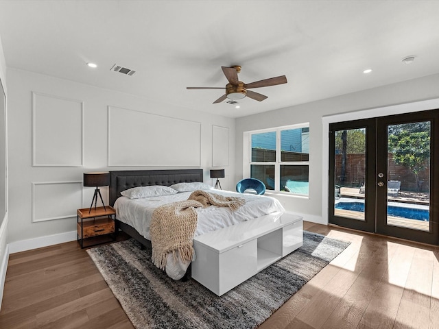 bedroom featuring hardwood / wood-style flooring, access to outside, ceiling fan, and french doors