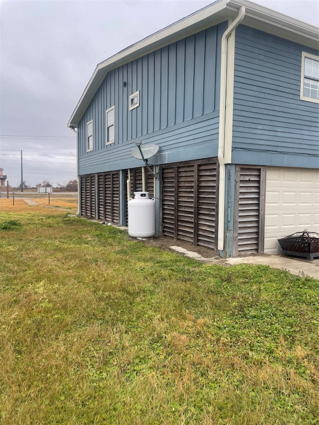 exterior space with a yard and a garage