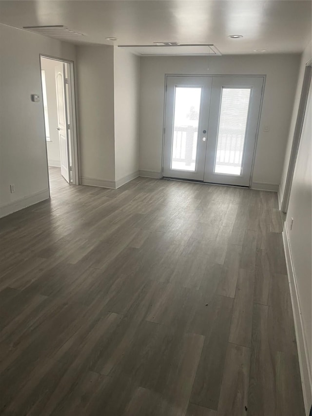 spare room featuring dark hardwood / wood-style flooring