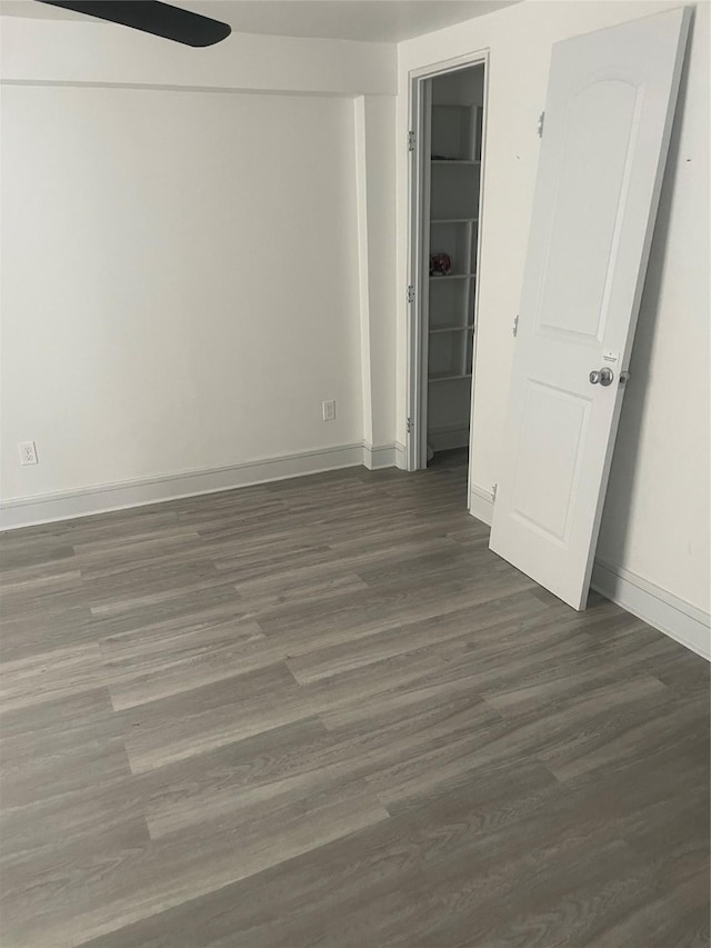 unfurnished room featuring dark hardwood / wood-style floors