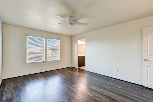 unfurnished room featuring a textured ceiling, dark hardwood / wood-style floors, and ceiling fan