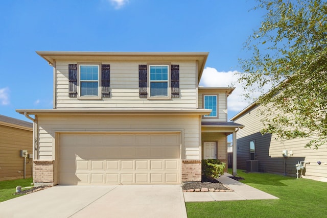 view of front of property featuring central AC unit, a garage, and a front yard