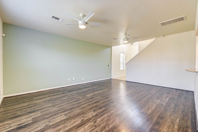 unfurnished room with dark hardwood / wood-style floors and ceiling fan