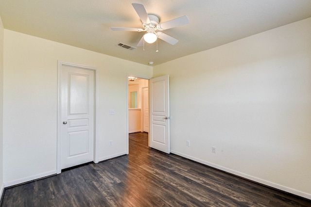 unfurnished bedroom with dark hardwood / wood-style floors and ceiling fan