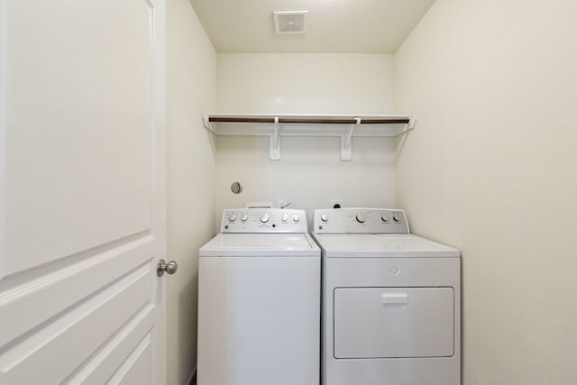 laundry room with washer and clothes dryer