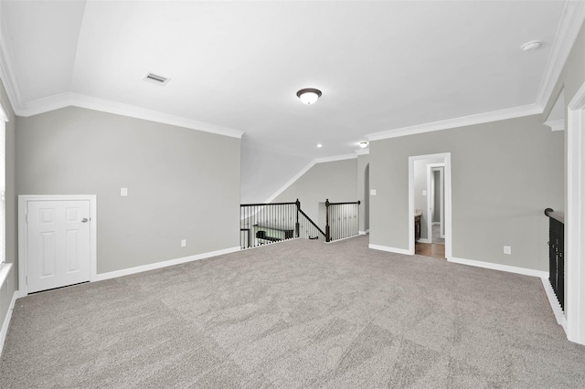 additional living space with vaulted ceiling and carpet flooring