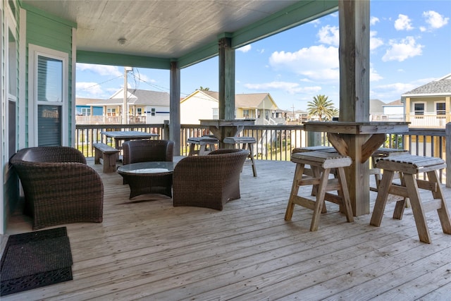 wooden terrace featuring a water view