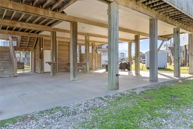 view of patio featuring a storage unit