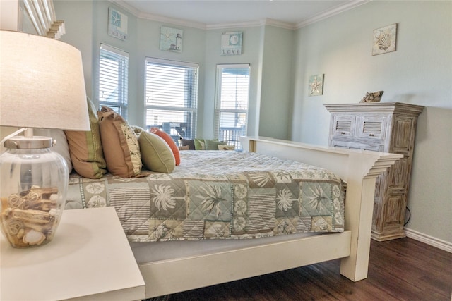 bedroom with ornamental molding and dark hardwood / wood-style flooring