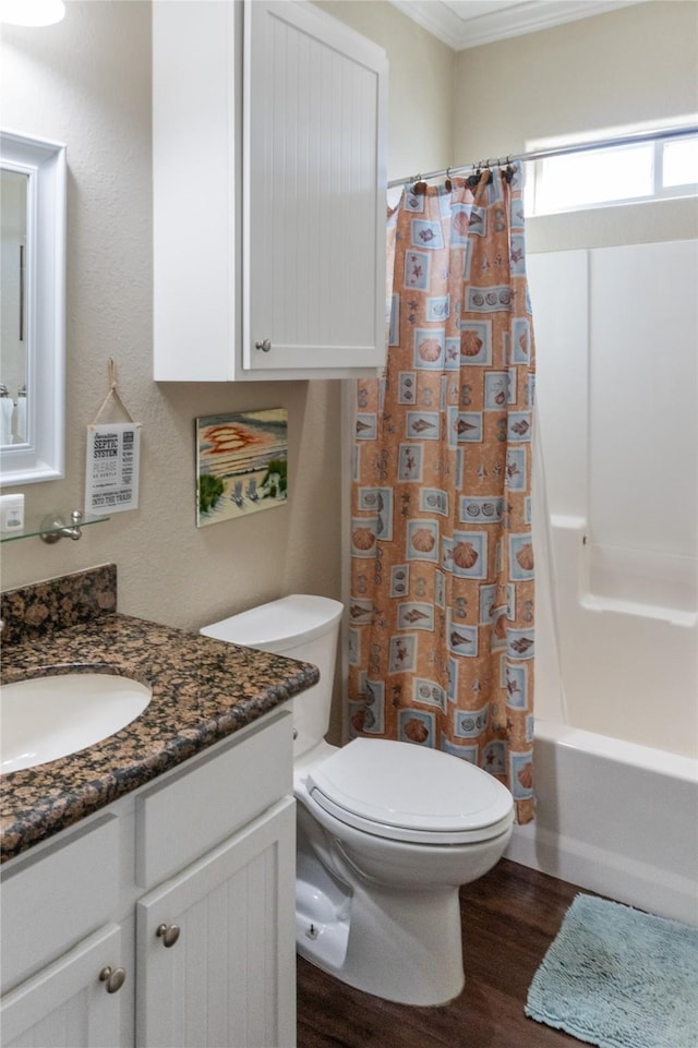 full bathroom featuring vanity, wood-type flooring, ornamental molding, toilet, and shower / bath combo with shower curtain