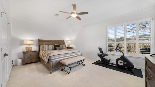 bedroom with multiple windows, light colored carpet, and ceiling fan