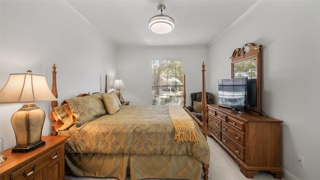 bedroom with multiple windows, ornamental molding, and light colored carpet