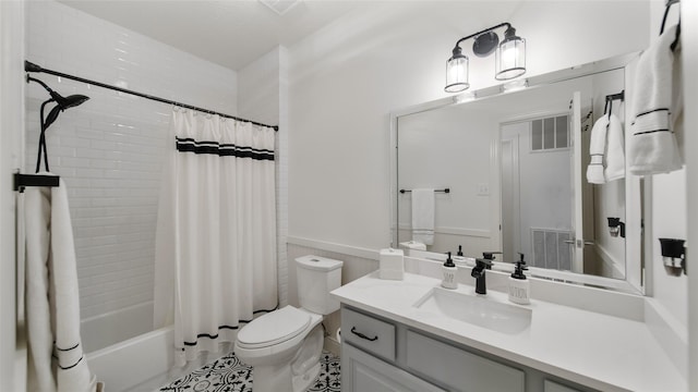 full bathroom with toilet, vanity, shower / bathtub combination with curtain, and tile patterned flooring