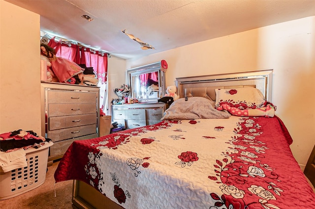 carpeted bedroom with a textured ceiling