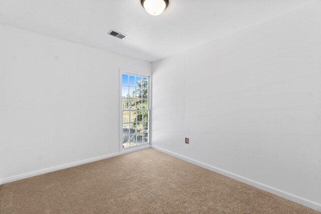 unfurnished room with carpet floors