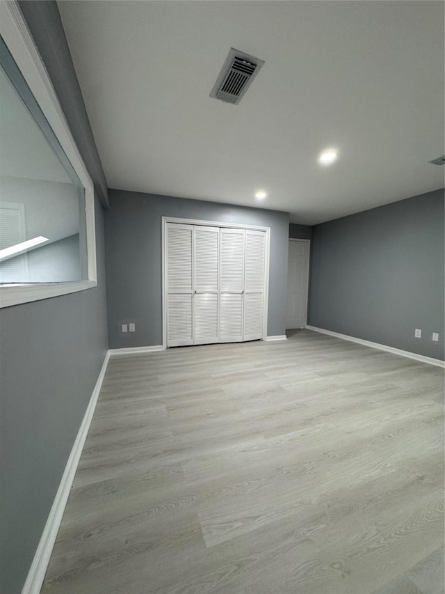 unfurnished bedroom featuring light hardwood / wood-style flooring