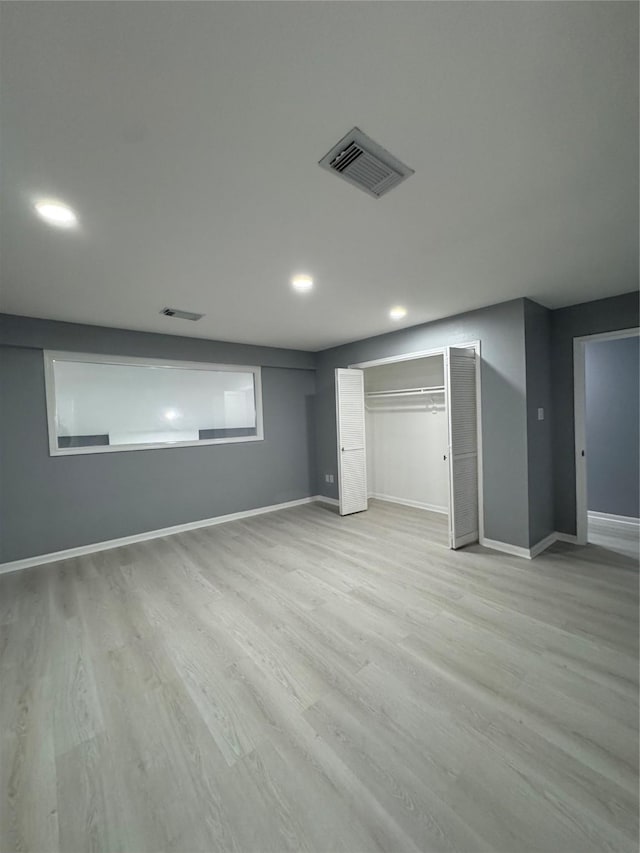 basement featuring light hardwood / wood-style floors