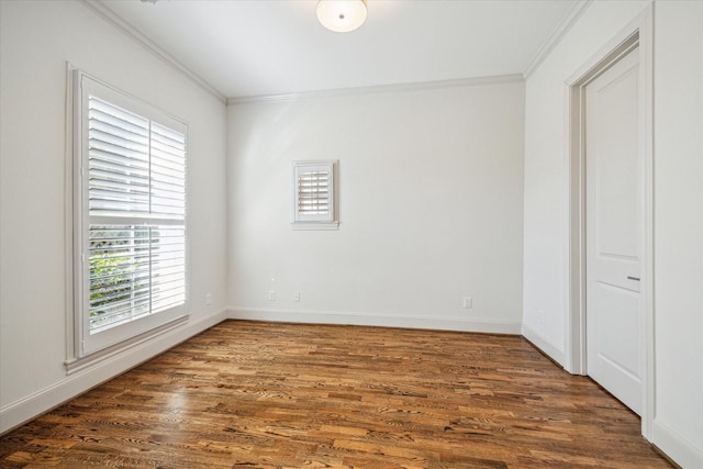 unfurnished bedroom featuring ornamental molding and dark hardwood / wood-style floors